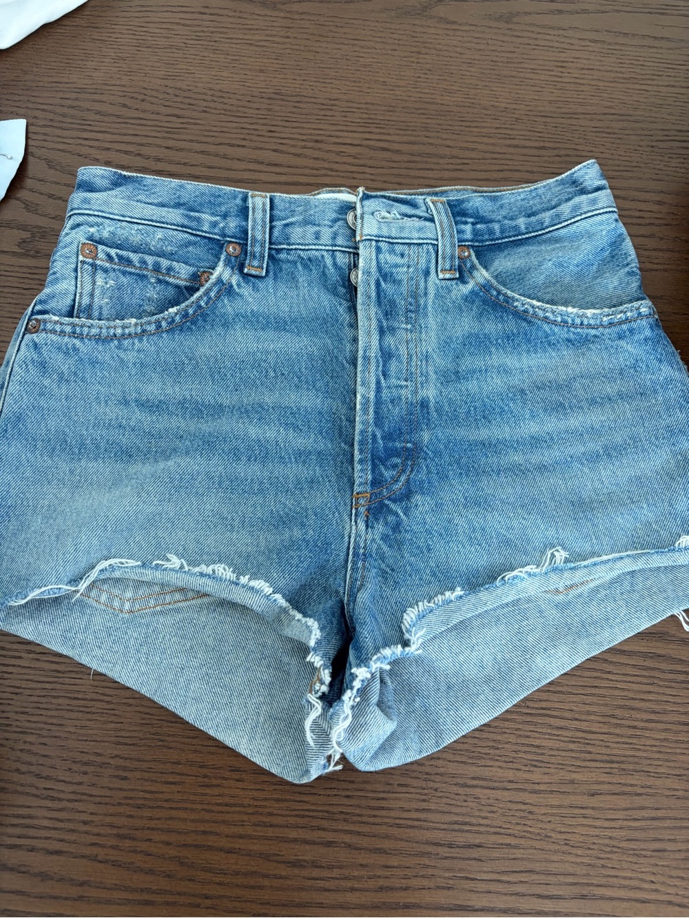 Agolde High-Waist Distressed Denim Shorts in Light Blue